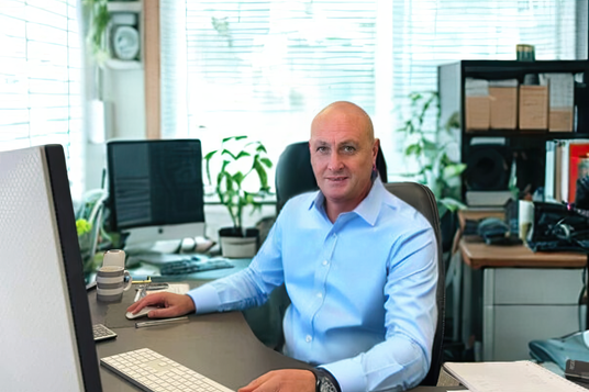Premier Technology team member in office
